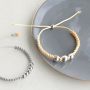 Pulseras y pendientes con fornituras de acero inoxidable 