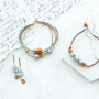 Preciosos pendientes y pulseras en colores c&aacute;lidos con abalorios Polaris Elements