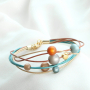 Preciosos pendientes y pulseras en colores c&aacute;lidos con abalorios Polaris Elements