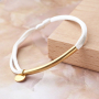 Crea coloridas pulseras con hilo de sat&eacute;n y entrepiezas de acero inoxidable