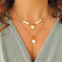 Cree joyer&iacute;a personalizada con colgantes de acero inoxidable y concha