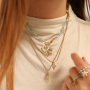 Crea bonitos collares y anillos con colgantes met&aacute;licos TQ de lat&oacute;n