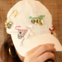 Trucos para dise&ntilde;ar con broches imperdibles decorativos con ojales