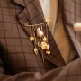 Trucos para dise&ntilde;ar con broches imperdibles decorativos con ojales